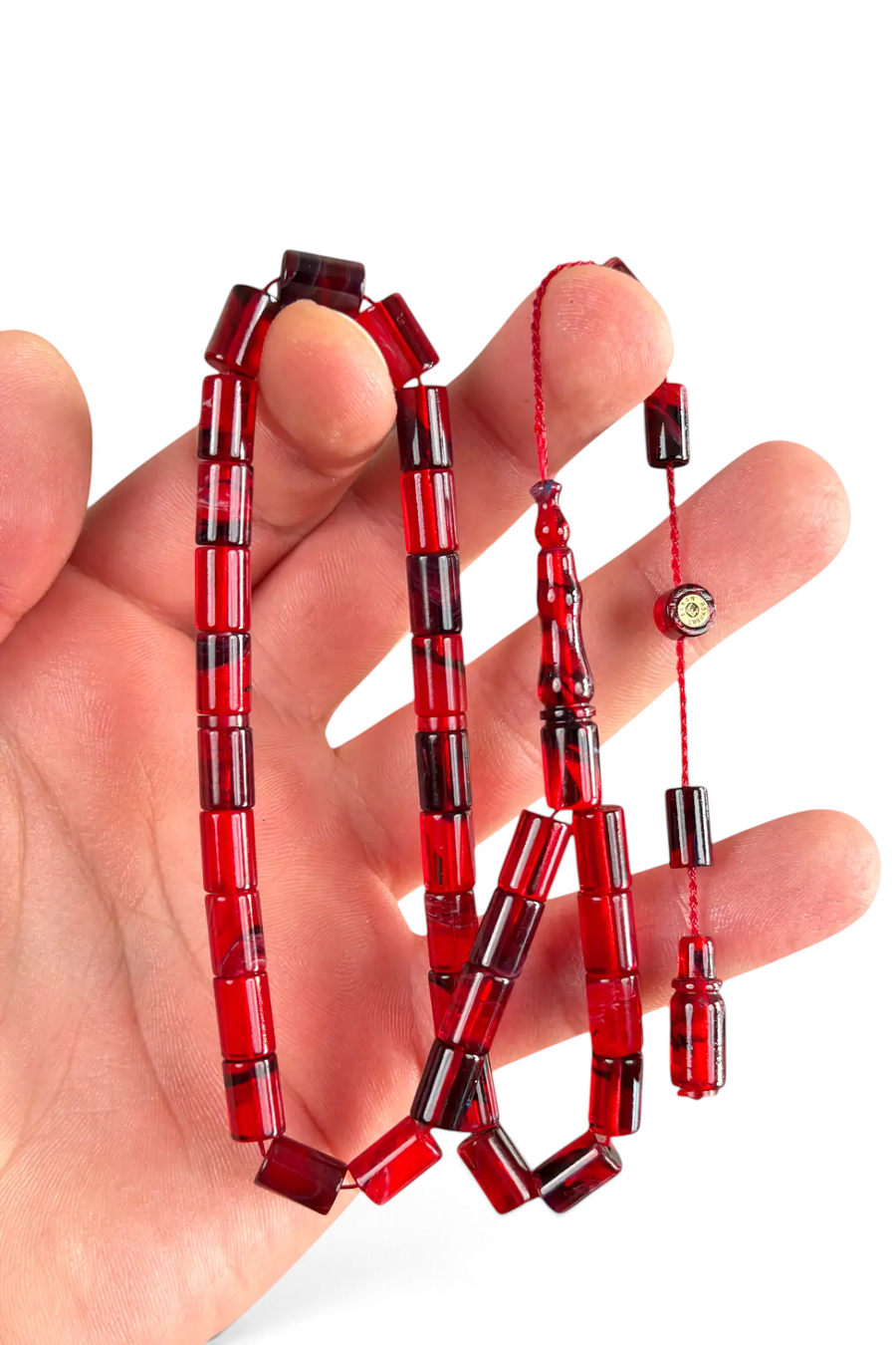 HERİF Erkan Çubukçu imzalı, 7x10 mm kesme kesim kırmızı ateş kehribar tesbih, sistemli püsküllü ve parlak yüzeyli.